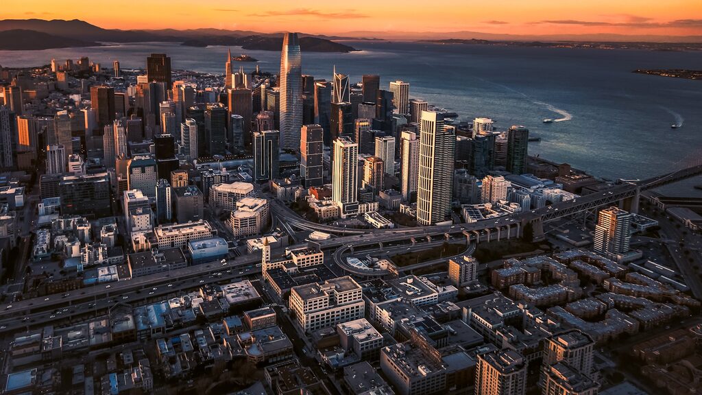 An aerial view of a city at sunset