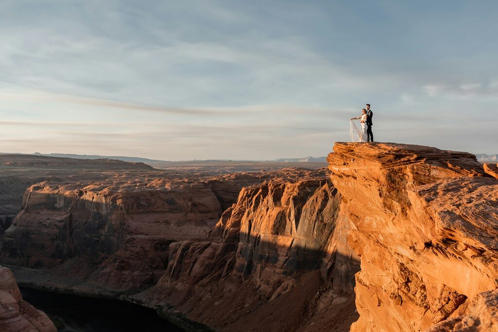 A man standing on top of a cliff